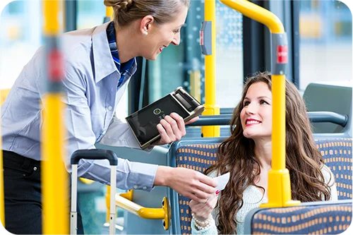Transit ticket inspector scanning QR code with handheld device
